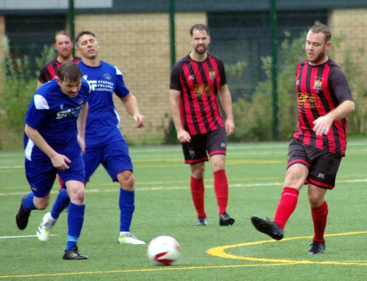 Joe Leahy threads a ball through for Tenby against Merlins Bridge